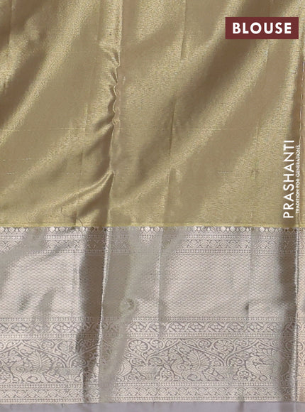 Semi kanchipuram tissue silk saree beige and pastel grey with allover silver zari woven brocade weaves and long zari woven border