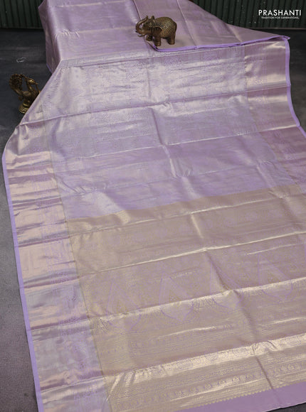 Semi kanchipuram tissue silk saree mild lavender with allover silver zari woven brocade weaves and long zari woven border