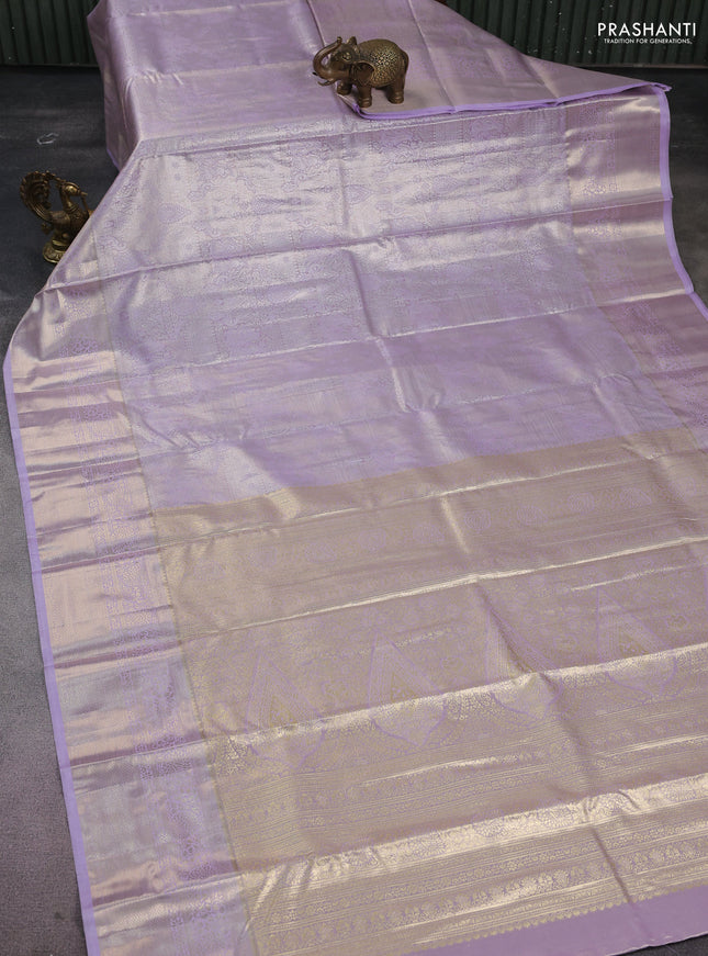 Semi kanchipuram tissue silk saree mild lavender with allover silver zari woven brocade weaves and long zari woven border