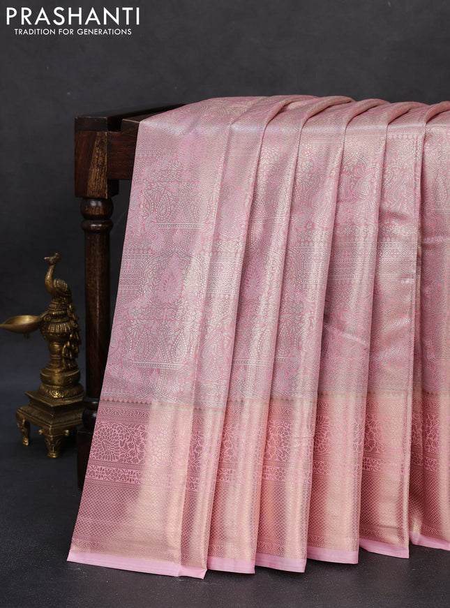 Semi kanchipuram tissue silk saree mild peach pink with allover silver zari woven brocade weaves and long zari woven border