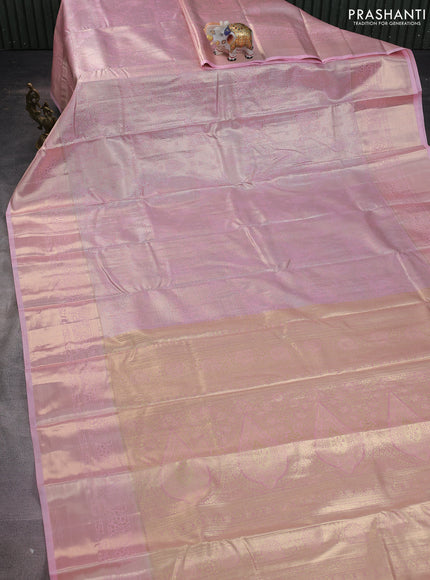 Semi kanchipuram tissue silk saree mild peach pink with allover silver zari woven brocade weaves and long zari woven border