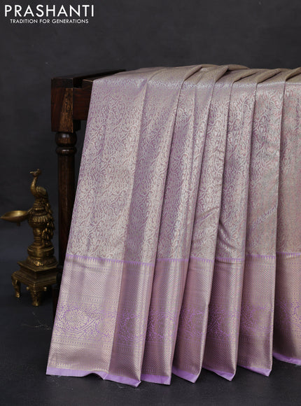 Semi kanchipuram tissue silk saree lavender with allover silver zari woven brocade weaves and zari woven border