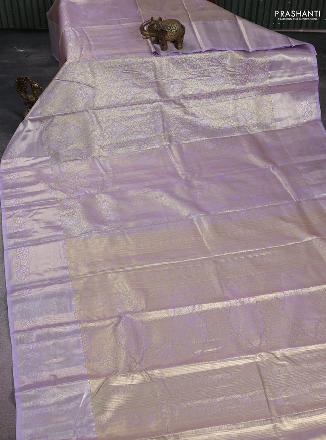 Semi kanchipuram tissue silk saree lavender with allover silver zari woven brocade weaves and zari woven border