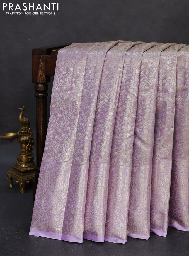Semi kanchipuram tissue silk saree lavender with allover silver zari woven brocade weaves and long zari woven border