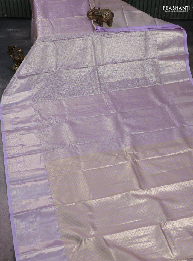 Semi kanchipuram tissue silk saree lavender with allover silver zari woven brocade weaves and long zari woven border