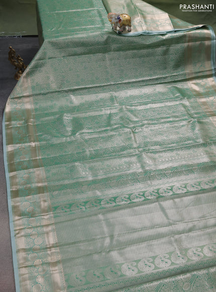 Semi kanchipuram tissue silk saree green shade with allover silver zari woven brocade weaves and zari woven border