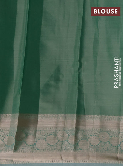 Semi kanchipuram tissue silk saree green shade with allover silver zari woven brocade weaves and zari woven border