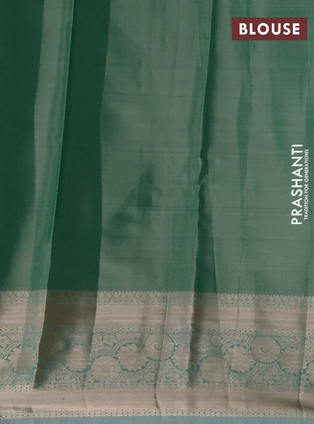 Semi kanchipuram tissue silk saree green shade with allover silver zari woven brocade weaves and zari woven border