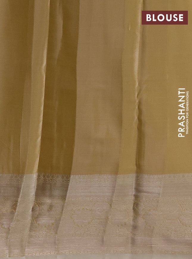 Semi kanchipuram tissue silk saree sandal with allover silver zari woven brocade weaves and zari woven border