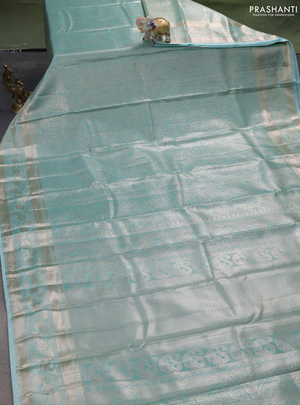 Semi kanchipuram tissue silk saree teal shade with allover silver zari woven brocade weaves and zari woven border