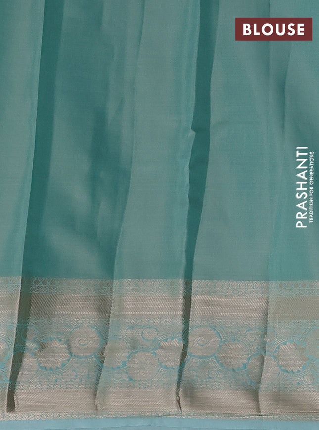 Semi kanchipuram tissue silk saree teal shade with allover silver zari woven brocade weaves and zari woven border