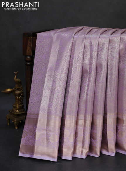 Semi kanchipuram tissue silk saree lavender with allover silver zari woven brocade weaves and zari woven border