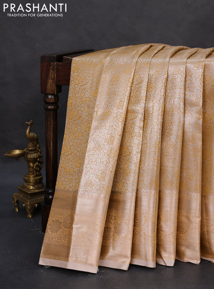 Semi kanchipuram tissue silk saree sandal with allover silver zari woven brocade weaves and zari woven border