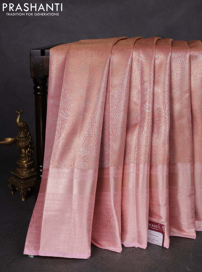Semi kanchipuram tissue silk saree mild peach with allover silver zari woven brocade weaves and long zari woven border