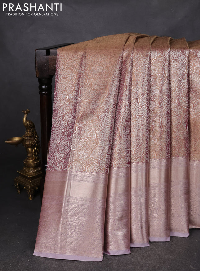 Semi kanchipuram tissue silk saree pastel pink with allover silver zari woven brocade weaves and long zari woven border
