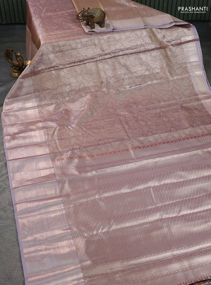 Semi kanchipuram tissue silk saree pastel pink with allover silver zari woven brocade weaves and long zari woven border