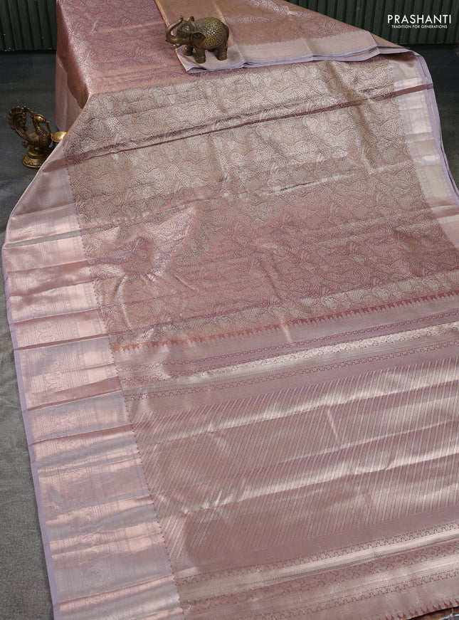 Semi kanchipuram tissue silk saree pastel pink with allover silver zari woven brocade weaves and long zari woven border