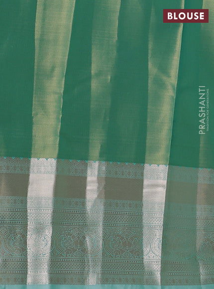 Semi kanchipuram tissue silk saree teal shade with allover silver zari woven brocade weaves and long zari woven border
