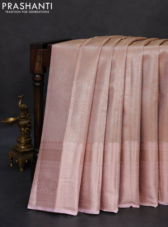 Semi kanchipuram tissue silk saree pastel peach and baby pink with allover silver zari woven brocade weaves and long zari woven border