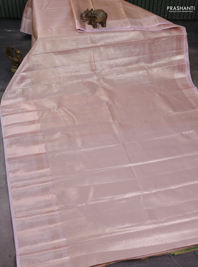 Semi kanchipuram tissue silk saree pastel peach and baby pink with allover silver zari woven brocade weaves and long zari woven border