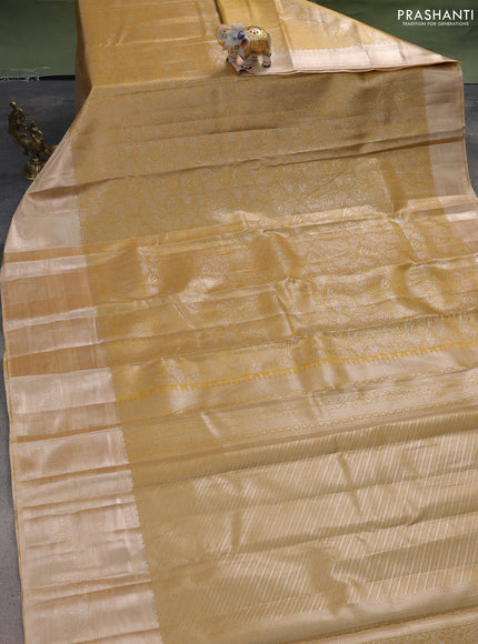 Semi kanchipuram tissue silk saree mustard yellow shade and sandal with allover silver zari woven brocade weaves and long zari woven border