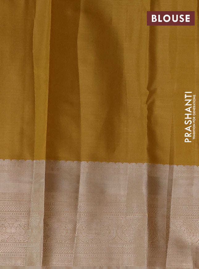 Semi kanchipuram tissue silk saree mustard yellow shade and sandal with allover silver zari woven brocade weaves and long zari woven border