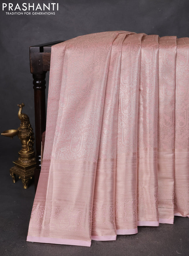 Semi kanchipuram tissue silk saree peach with allover silver zari woven brocade weaves and long zari woven border