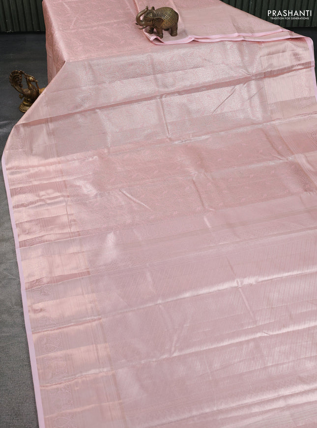 Semi kanchipuram tissue silk saree peach with allover silver zari woven brocade weaves and long zari woven border