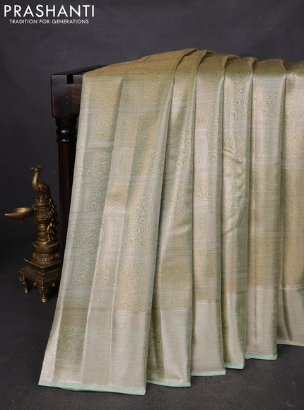 Semi kanchipuram tissue silk saree pista green with allover silver zari woven brocade weaves and zari woven border