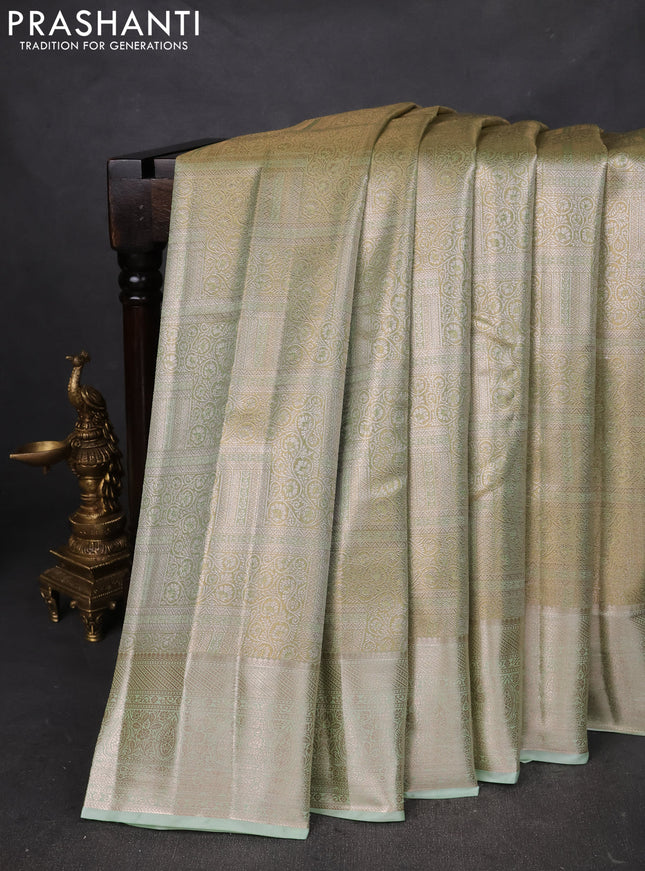 Semi kanchipuram tissue silk saree pista green with allover silver zari woven brocade weaves and zari woven border