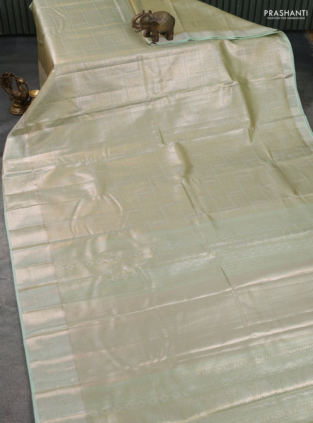 Semi kanchipuram tissue silk saree pista green with allover silver zari woven brocade weaves and zari woven border
