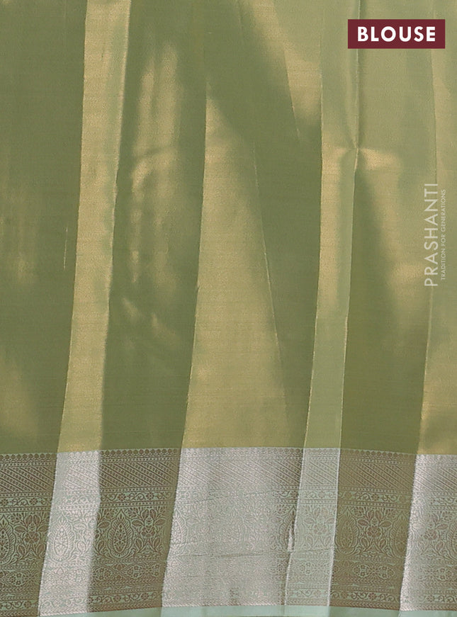 Semi kanchipuram tissue silk saree pista green with allover silver zari woven brocade weaves and zari woven border