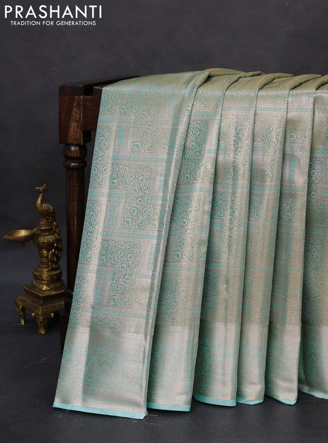 Semi kanchipuram tissue silk saree teal with allover silver zari woven brocade weaves and zari woven border