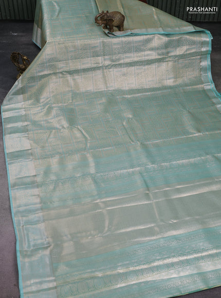 Semi kanchipuram tissue silk saree teal with allover silver zari woven brocade weaves and zari woven border