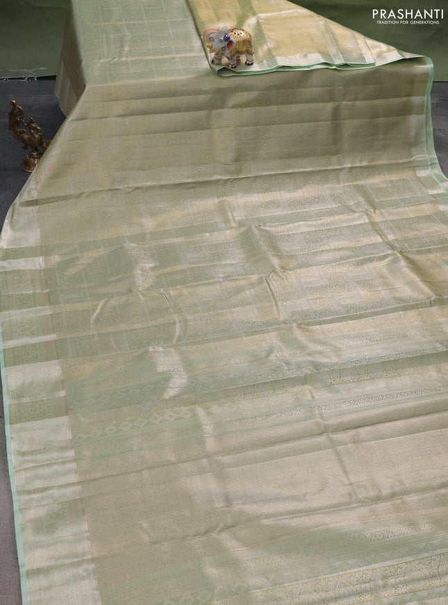 Semi kanchipuram tissue silk saree pista green with allover silver zari woven brocade weaves and zari woven border