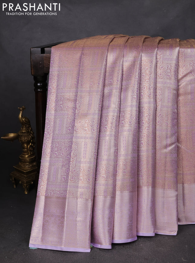 Semi kanchipuram tissue silk saree mild lavender and lavender with allover silver zari woven brocade weaves and zari woven border