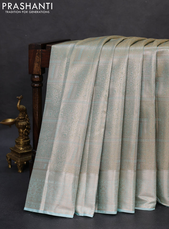 Semi kanchipuram tissue silk saree pastel blue shade and teal with allover silver zari woven brocade weaves and zari woven border