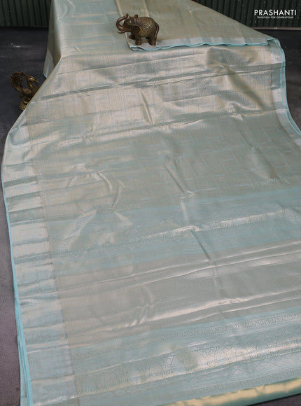Semi kanchipuram tissue silk saree pastel blue shade and teal with allover silver zari woven brocade weaves and zari woven border