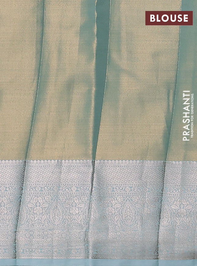 Semi kanchipuram tissue silk saree pastel blue shade and teal with allover silver zari woven brocade weaves and zari woven border