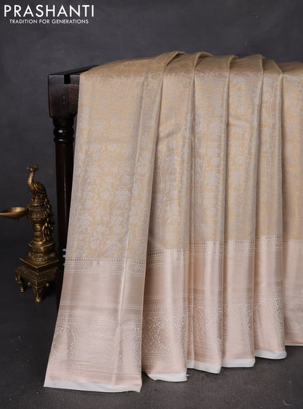 Semi kanchipuram tissue silk saree cream with allover silver zari woven brocade weaves and long zari woven border
