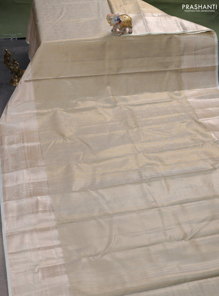 Semi kanchipuram tissue silk saree cream with allover silver zari woven brocade weaves and long zari woven border