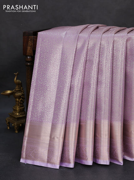 Semi kanchipuram tissue silk saree mild lavender with allover silver zari woven brocade weaves and zari woven border