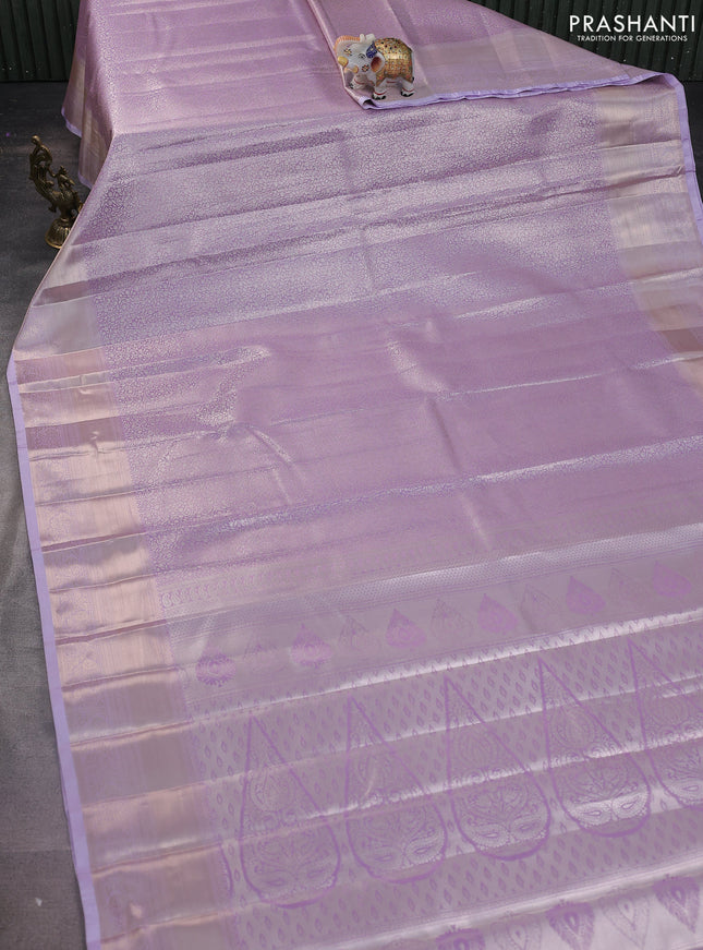 Semi kanchipuram tissue silk saree mild lavender with allover silver zari woven brocade weaves and zari woven border