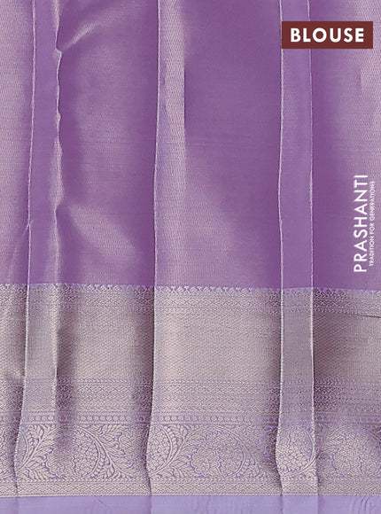 Semi kanchipuram tissue silk saree mild lavender with allover silver zari woven brocade weaves and zari woven border