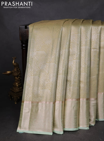 Semi kanchipuram tissue silk saree pista green with allover silver zari woven brocade weaves and zari woven border