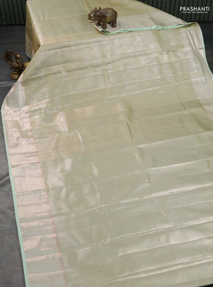 Semi kanchipuram tissue silk saree pista green with allover silver zari woven brocade weaves and zari woven border