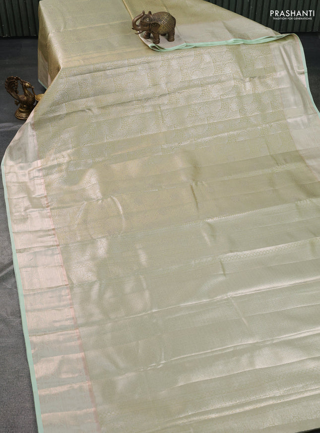 Semi kanchipuram tissue silk saree pista green with allover silver zari woven brocade weaves and zari woven border
