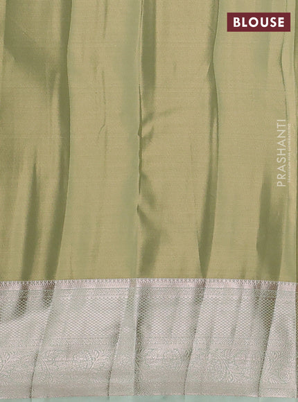 Semi kanchipuram tissue silk saree pista green with allover silver zari woven brocade weaves and zari woven border