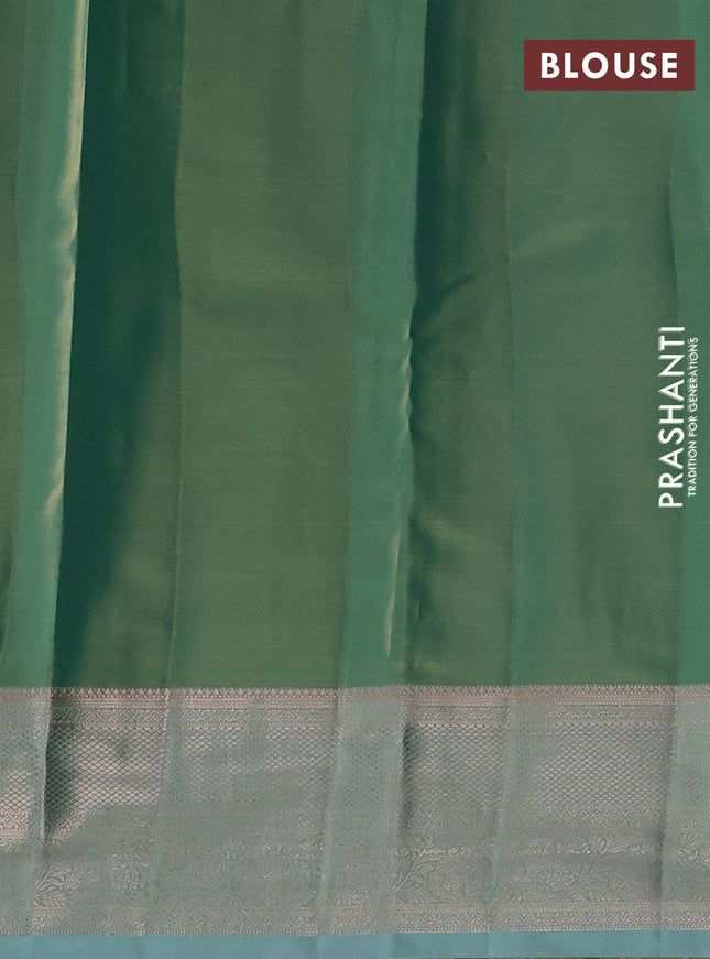 Semi kanchipuram tissue silk saree dual shade of teal green with allover silver zari woven brocade weaves and zari woven border