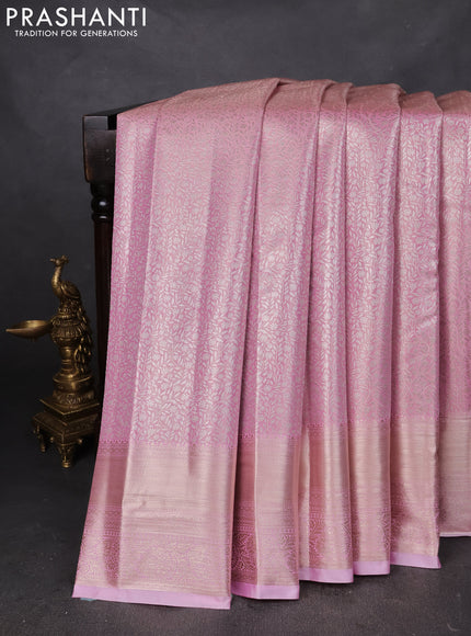 Semi kanchipuram tissue silk saree light pink with allover silver zari woven brocade weaves and zari woven border